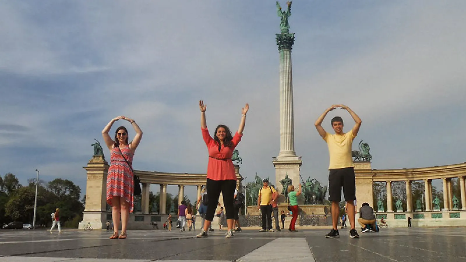 Graduate students in an East European country doing the O-H-I-O symbol
