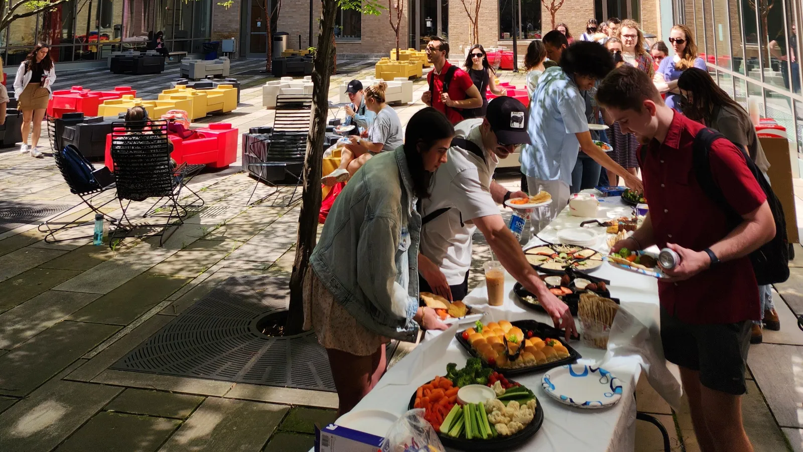 students get food in line at slavic spring tea