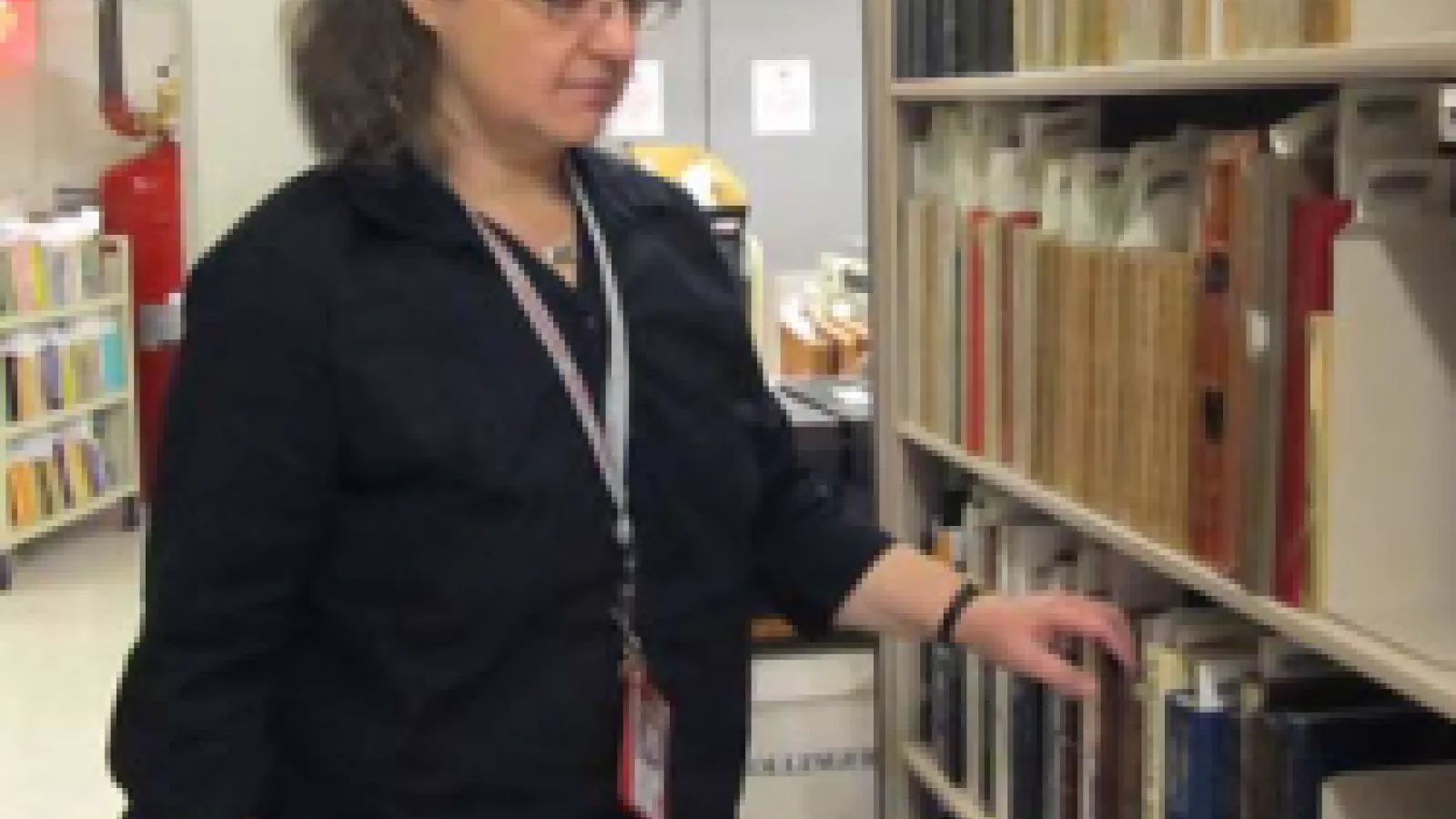 photo of Pasha Johnson in the library