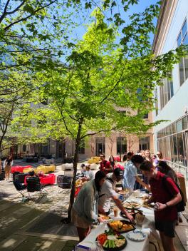 students get food in line at slavic spring tea