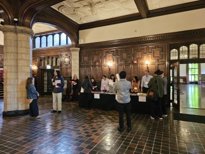 inside lecture hall with several speakers