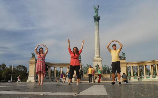 Graduate students in an East European country doing the O-H-I-O symbol