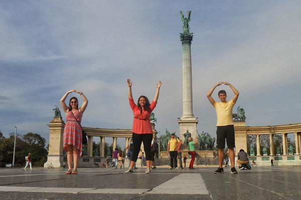 Graduate students in an East European country doing the O-H-I-O symbol