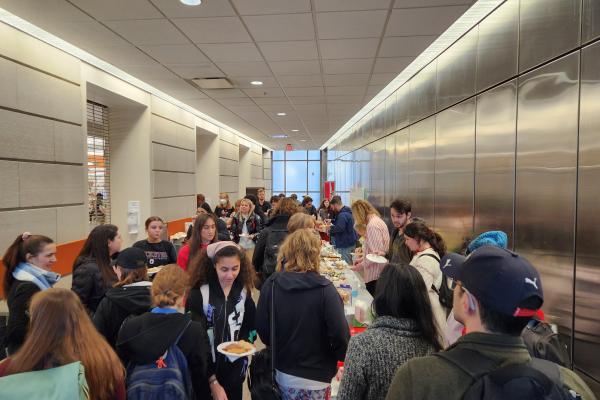 students getting food in a line at kapusstnik
