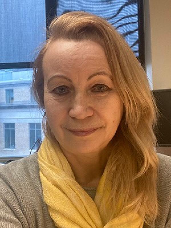 Helen Myers, a woman with long blonde hair, smiling at the camera.